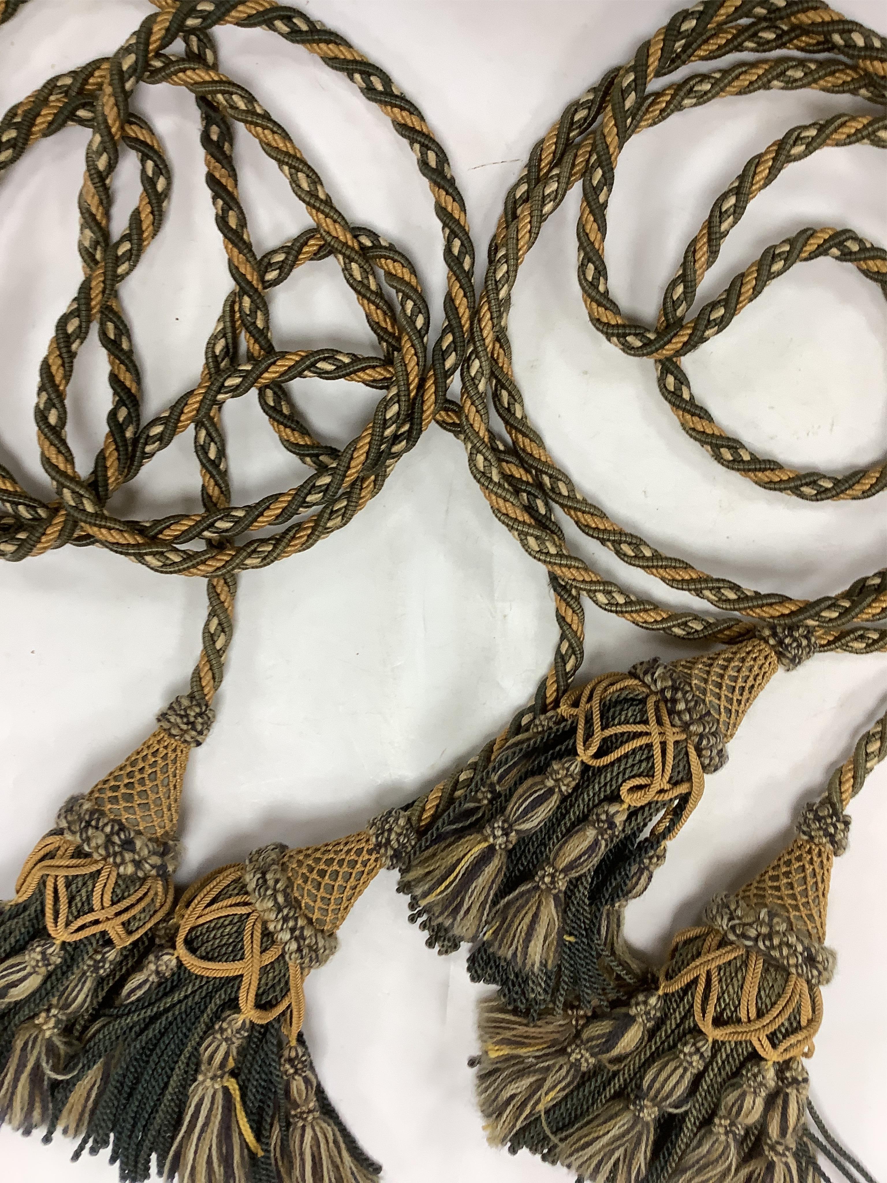 Two 20th century long corded, double tasselled silk and wool tie backs, 194cm each. Condition - some fading.